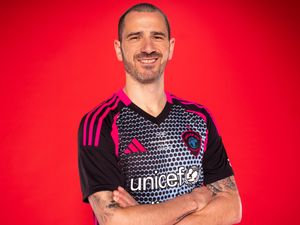 Leonardo Bonucci in profile against a red background