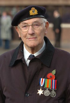 Geoffrey Ensor wearing his medals