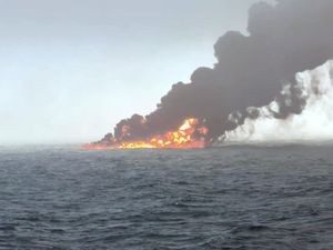 Black smoke billowing into the air after a crash between an oil tanker and a cargo ship off the coast of East Yorkshire