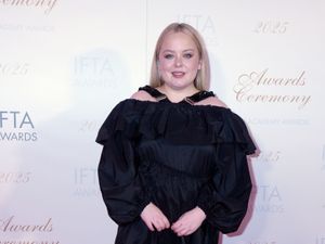 Nicola Coughlan in a black dress on the red carpet