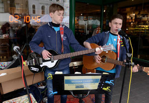The clock counts down on Guitar Cubed's 25 hours of non-stop busking outside Starbucks