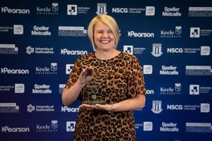 Michelle Coates, DPC Director, with the award.