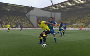 With his big right foot and yellow army - Troy Deeney hold up the ball