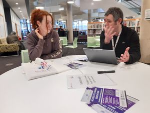 Dave Craig, right, outreach officer for Learn Telford, with a young visitor wanting to find out more. Picture: LDRS