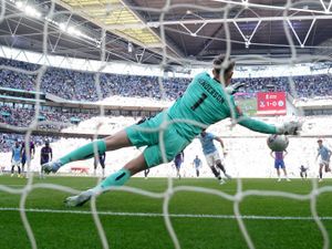 Dean Henderson saves a penalty at Wembley