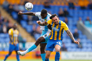 Ryan Bowman of Shrewsbury Town and Deji Oshilaja of Burton Albion. (AMA)