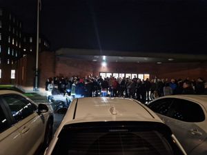 Members of the public protesting the decision had gathered outside the council building before the meeting