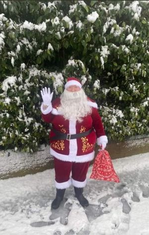 Father Christmas waiting to treat the children to a special day