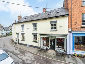 Supporting image for story: Thriving café and bed & breakfast on the market - with part of medieval castle wall in the garden
