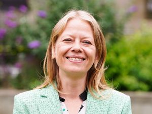 Sian Berry wearing a green jacket and smiling