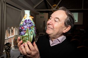 Antiques legend Eric Knowles with an example of Moorcroft Pottery 