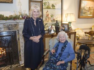 The Queen, then the Duchess of Cornwall, meeting June Spencer