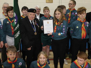 Oakengates RBL president Jeff Turley presents a Certificate of Appreciation to Erin Franks. 