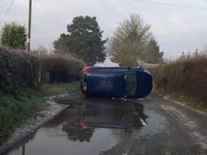 Supporting image for story: Car on its side in one of two crashes on icy North Shropshire roads