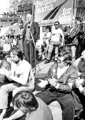 May 15, 1981. The caption reads: 'Tony Benn speaks at the rally in St Peter's Square, Wolverhampton. The People's March for Jobs is not just about unemployment but about human dignity, said Labour left-wing MP Mr Tony Benn. The march was growing in strength and influence each day, he told a mass rally in St Peter's Square, Wolverhampton. 'It is a march for human dignity and against those forces that try to persuade us again and again that men and women should be crucified on the cross of monetarism,' he said. 'It is a march against militarism that says people must be sacrificed in a war by nuclear weapons in some conflict we are told we cannot escape,' he said. Mr Benn took a side-swipe at some other Labour MPs by saying the march had done more than some political leaders to uphold the constitution of the Labour Party, which insisted workers should realise the fruits of their labours. The Bishop of Wolverhampton, the Right Rev Barry Rogerson, described joining the march through the town as a 'marvellous experience of fellowship and warmth.'