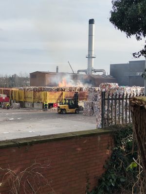 The fire involves a large stack of paper at the recycling plant. 