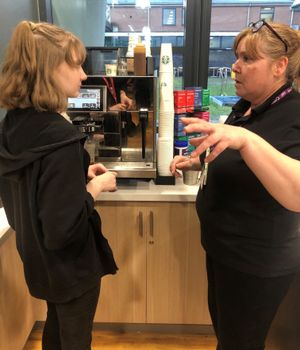 Amy Lockley gets some tips from Telford College barista Sara Davies
