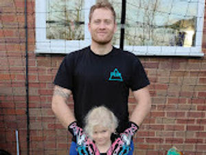 Supporting image for story: Goalkeeping father and son become global social media stars after boy's last-minute save