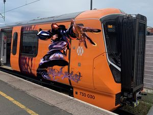 The awesome artwork was painted on the side of a West Midlands Railway train. 