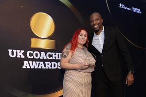 Georgina Evans-Goodrich collects her award at the UK Coaching Awards ceremony