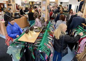 Excitement – eager shoppers search the rails for bargains