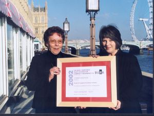 Jean receiving a British Urban Regeneration Award on behalf of the charity in 2002