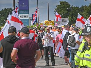 Supporting image for story: Anti-immigration protesters and counter-demonstrators gather outside Cannock hotel after march from town centre