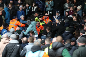 Trouble erupts in the stadium as a Wolverhampton Wanderers fan  celebrates their second goal amongst Albion fans as a steward and Police attempt to protect him, forcing a 36 minute game stoppage (Photo by Adam Fradgley/West Bromwich Albion FC via Getty Images).