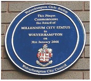 A blue plaque at the Civic Centre commemorating Wolverhampton's city status