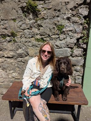 An image shows Birmingham woman Megan Smith Evans sitting down with her Cocker Spaniel.
