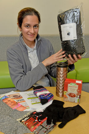 Volunteer Mandeep Kaur shows off one of the warm packs