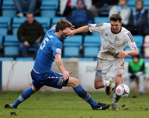 Adam Cowen of Stockport County and Andy Owens of AFC Telford United