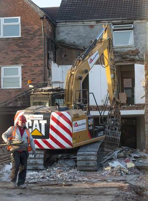 One of the derelict buildings in High Street, Bilston, being demolished as part of the Urban village project
