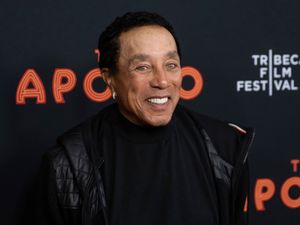 Smokey Robinson speaks to the media