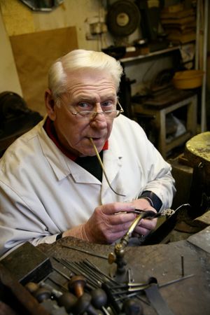 Jobbing jeweller Tom Allcott in his workshop in Birmingham Jewellery Quarter.