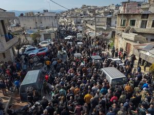 A funeral procession for four Syrian security force members