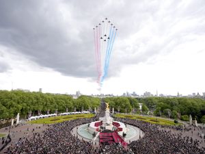 The Red Arrows fly over Buckingham Palace