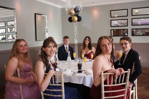 Students settling in awaiting their food
