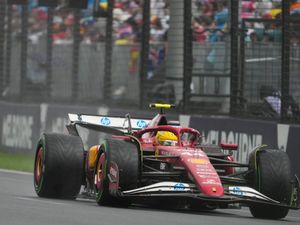 Lewis Hamilton races his Ferrari in Melbourne