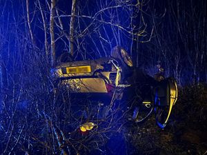 Supporting image for story: Passenger escapes with minor injury after car rolls on to roof off A41
