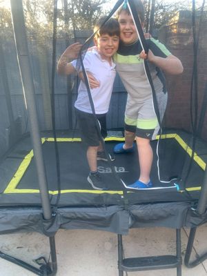 George and Oliver completing their jumping challenge in aid of Parkinson's UK