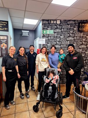 Shaz Saleem with Aimee Guy, Claire Smith, Olivia, Sahara Sisters and staff at Village Cafe Kingswinford 