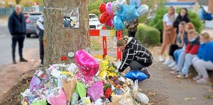 Flowers, balloons and cards have been left at the crash scene