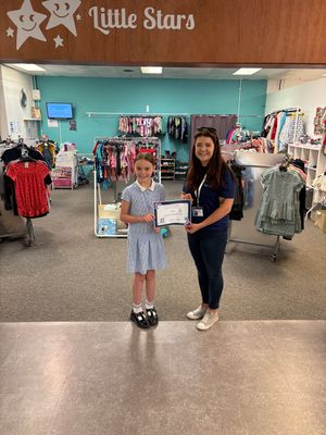 Bella meets with charity founder and CEO, Leanne Simcoe to be awarded a special certificate.