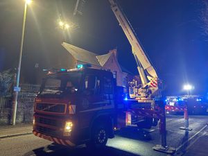 Firefighters used the aerial platform to get above the chimney and spray water down the flue. Picture: Market Drayton Fire Station