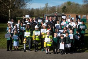 Children at Hollinswood Primary School celebrate with their pictures.