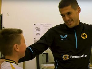 Supporting image for story: Heartwarming moment bullied Wolves fan embraces his hero Conor Coady in surprise meeting