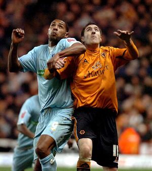 Finally - Clive Platt, pictured against Wolves' Stephen Ward at Molineux, got the chance to play in the Championship with Colchester United and later Coventry City.