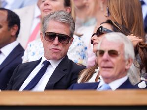 Supporting image for story: Hugh Grant and the Queen among famous faces in crowd during day 10 of Wimbledon