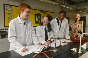 Pupils Callum Groom, Lily Mills and Emmanuella Stanley in a science lesson